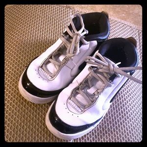 Boys Jordan’s black, white, and gold  size 12